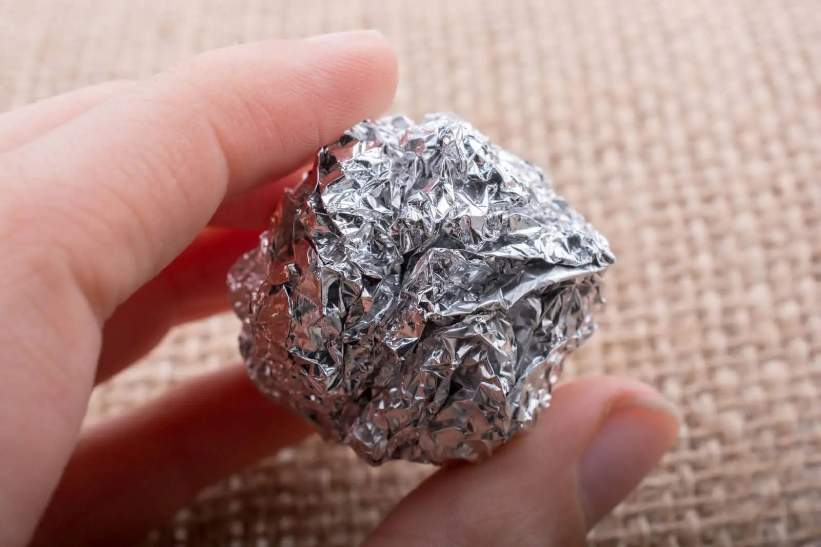 Aluminum foil in a ball used to clean baking sheets