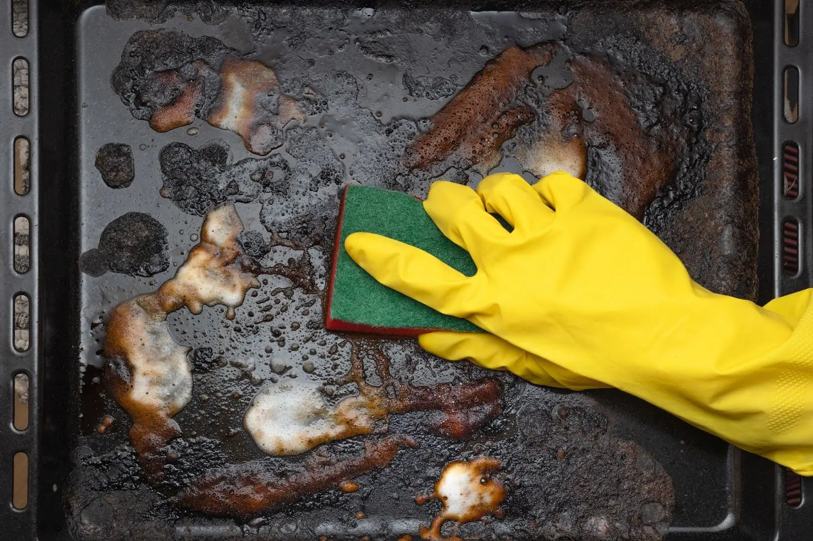 Hand washing a cookie sheet