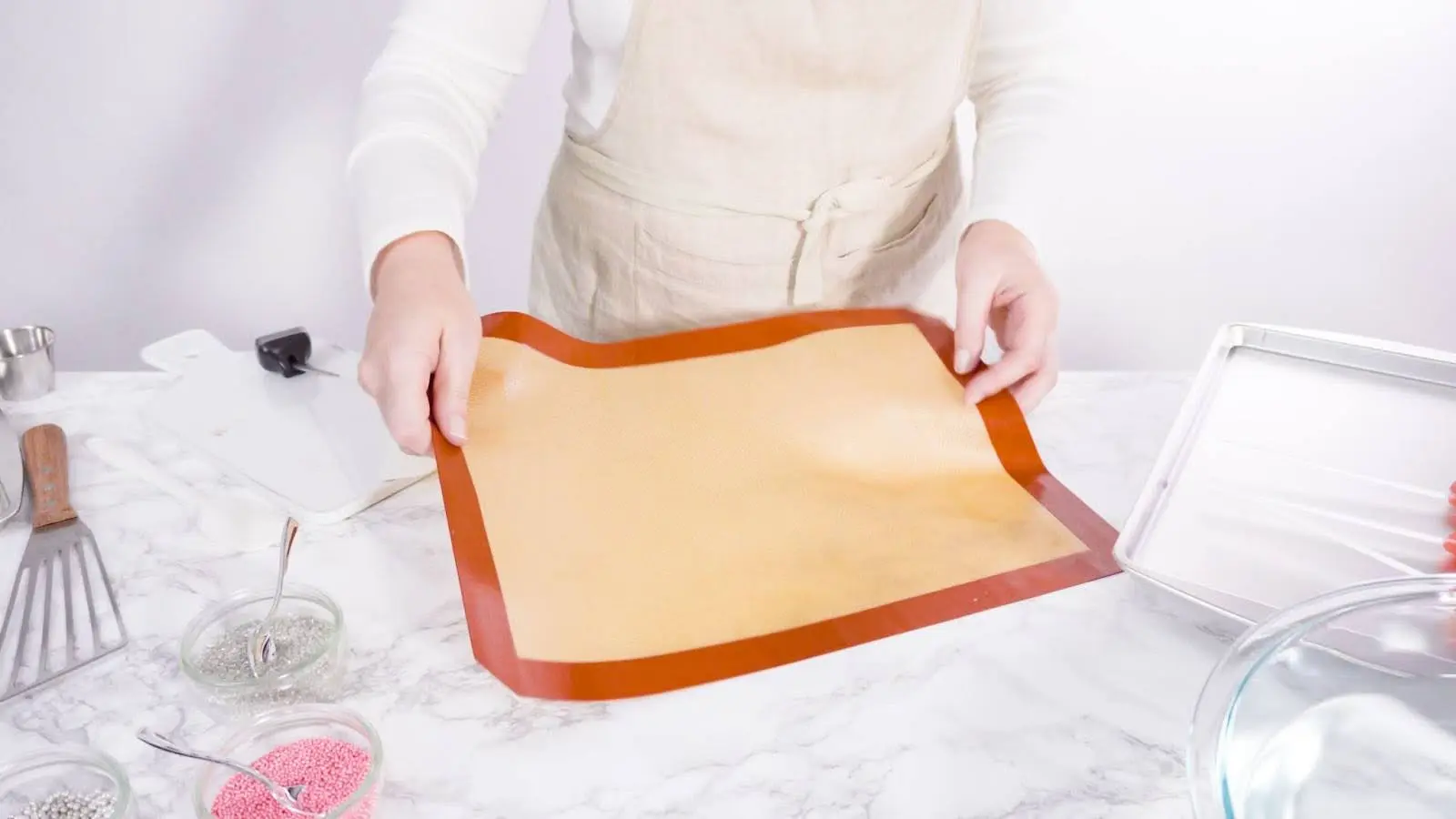 Silicone baking mat to protect baking sheets